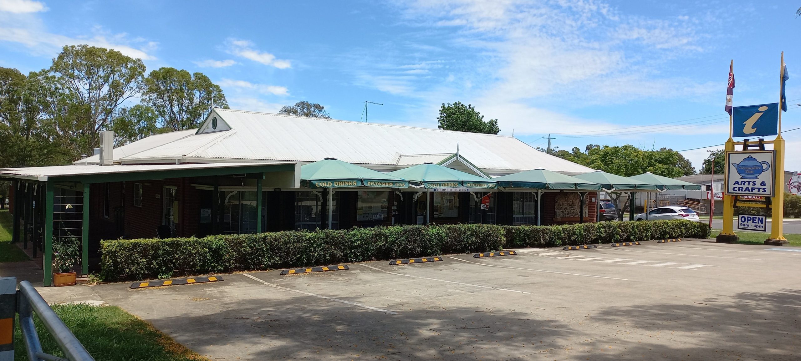 Our lovely building with the umbrellas over our Tea Garden for shade while enjoying a Devonshire Tea