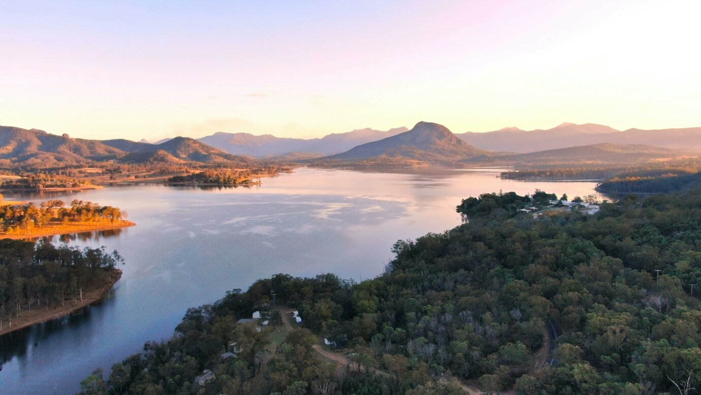 aerial view at sunset over Lake Moogerah to the mountain beyond