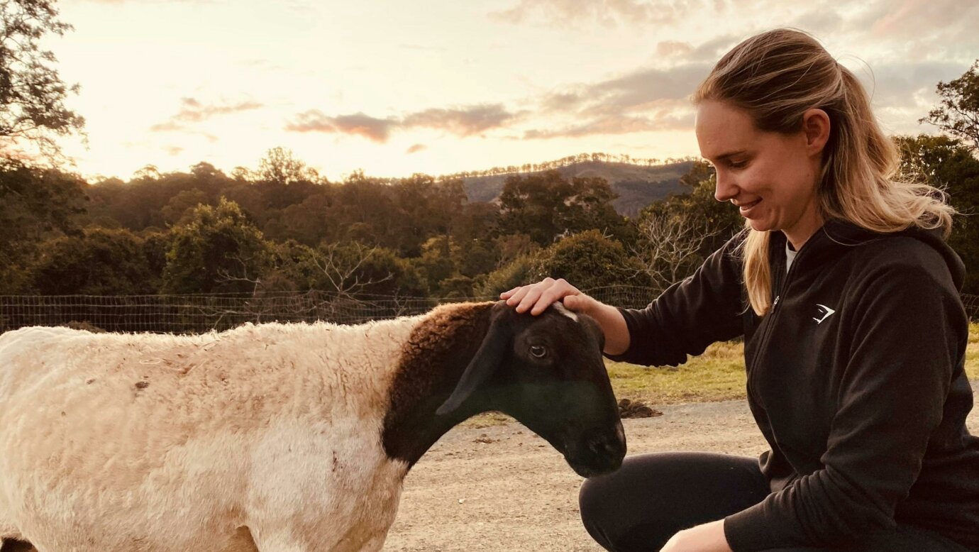 Guest interacting with the farm animals at Country Mile Escape